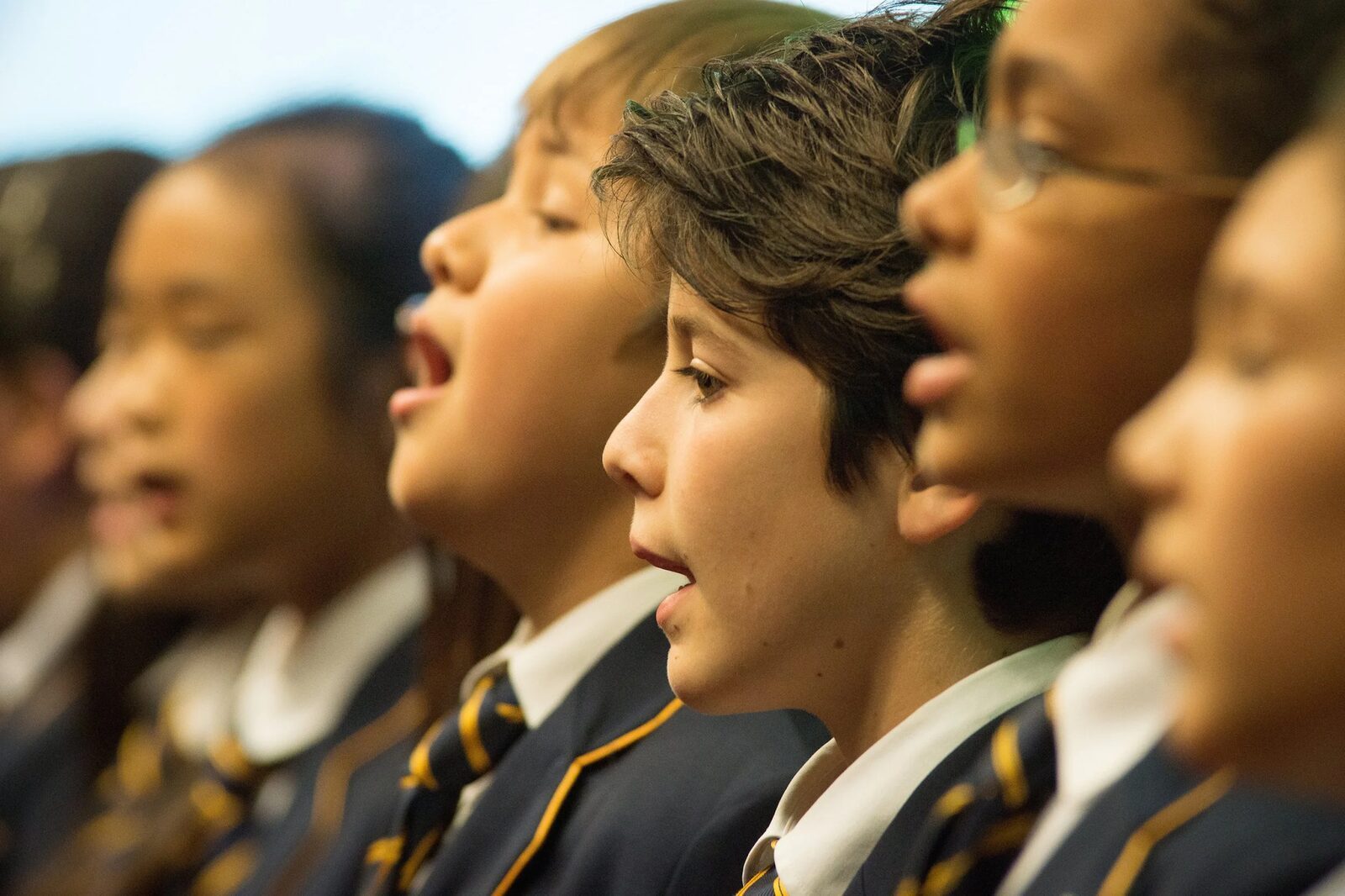 ISJ school choir singing in blazers and ties