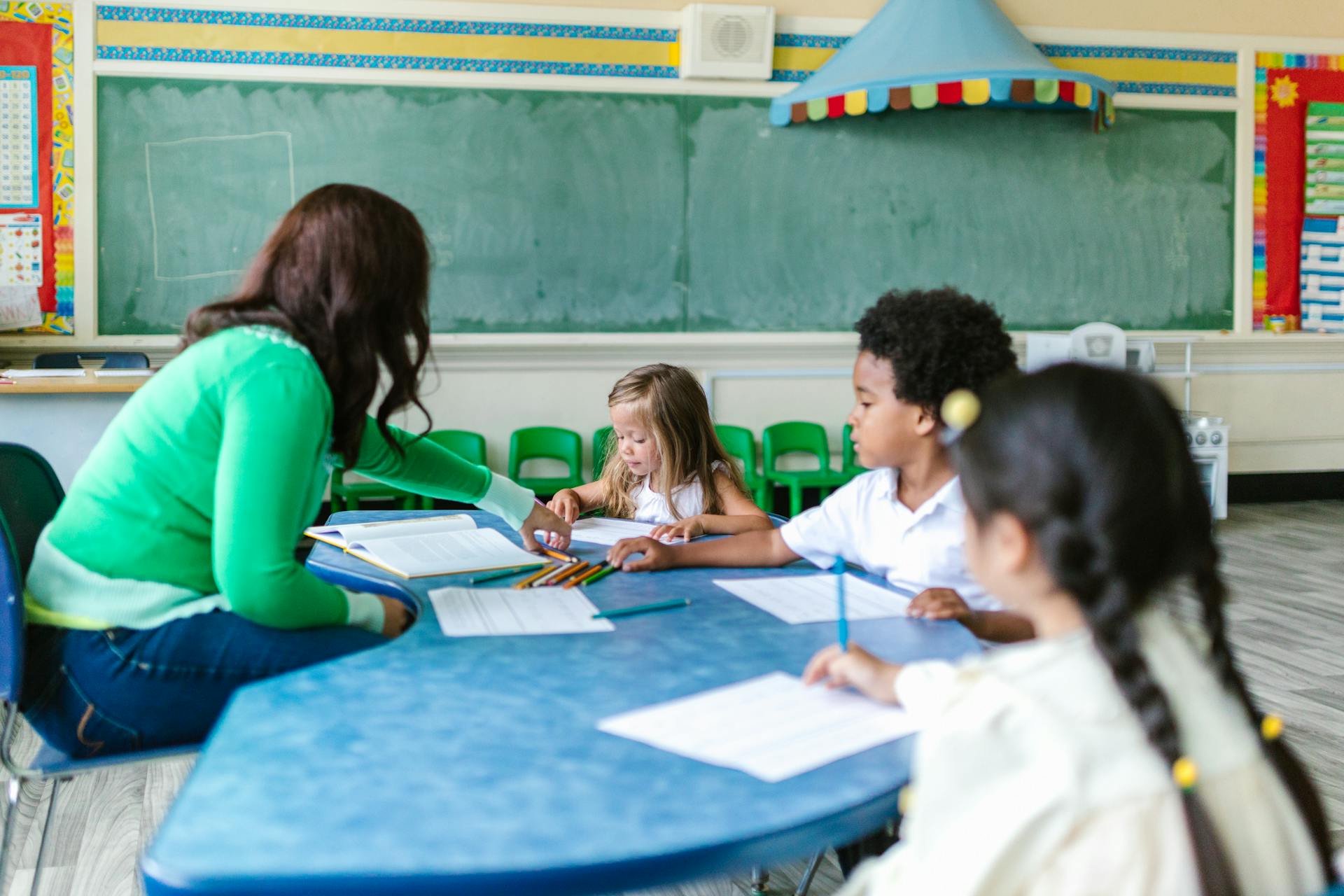 Teacher working with primary pupils in an international school classroom in Jakarta
