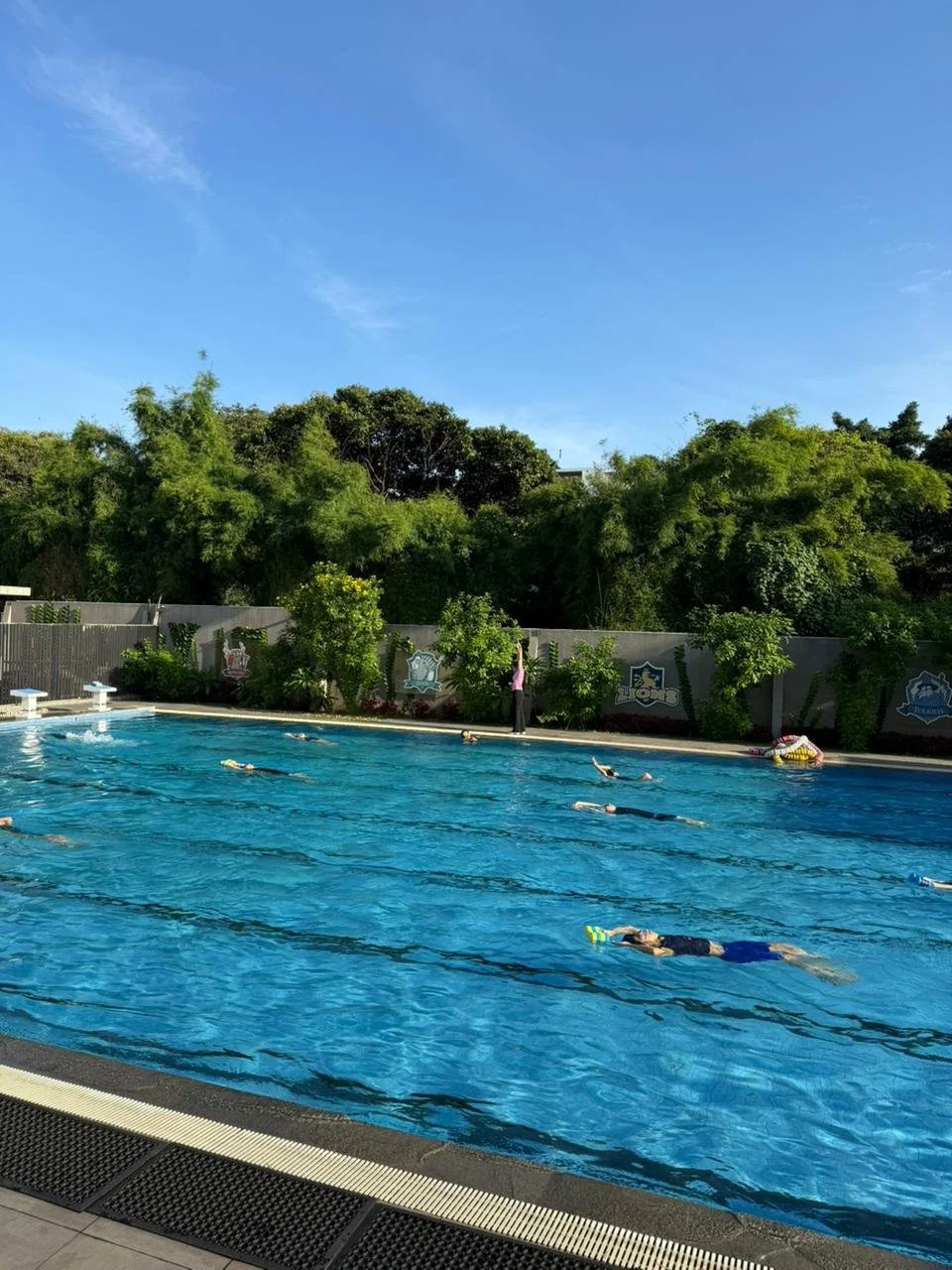 ISJ students swimming in the early morning pool sessions